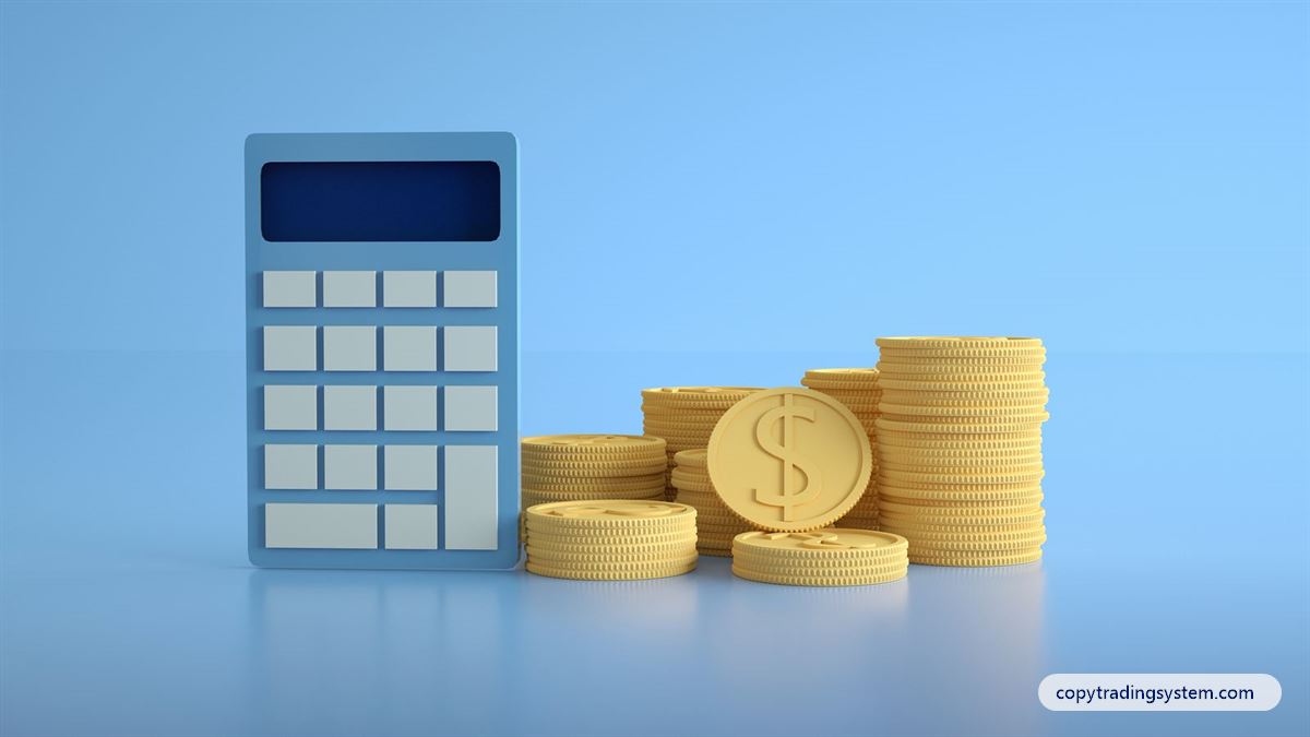 Is copy trading profitable: a calculator next to stacks of gold coins